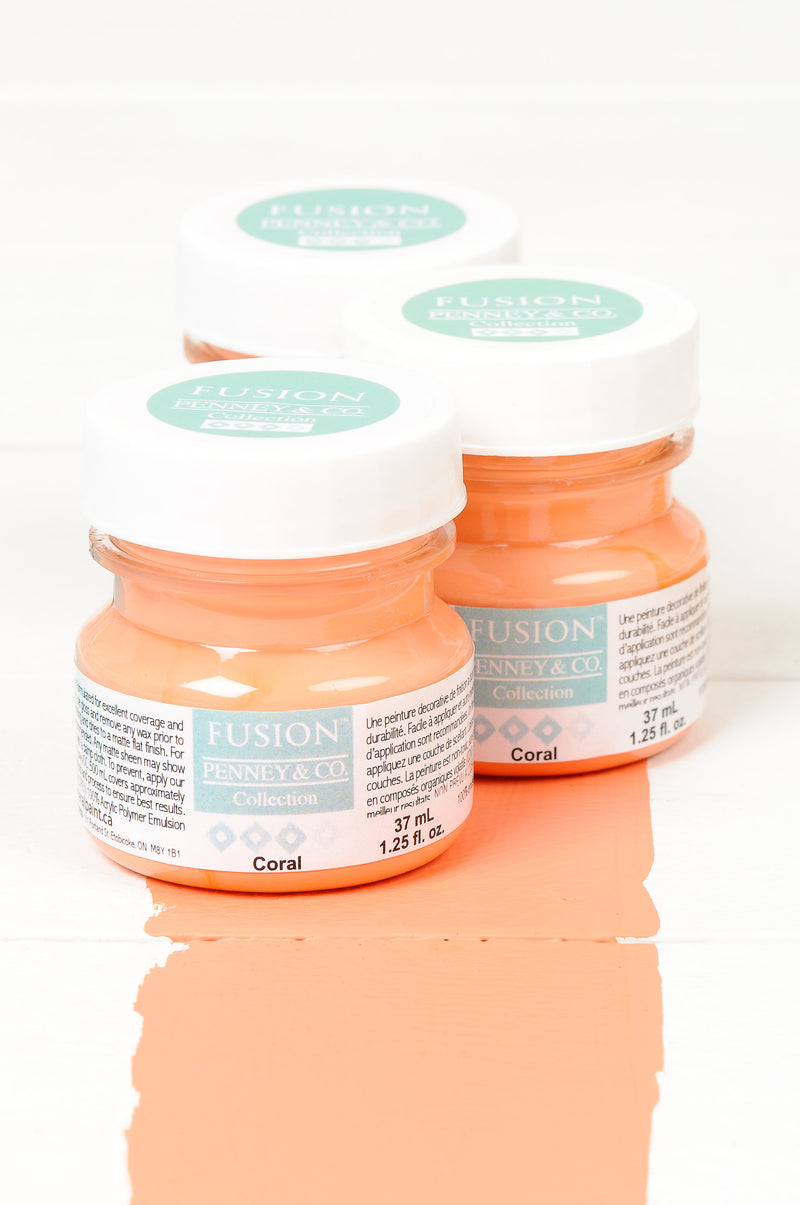 Fusion mineral paint tester pots with colour example of coral brush stroke